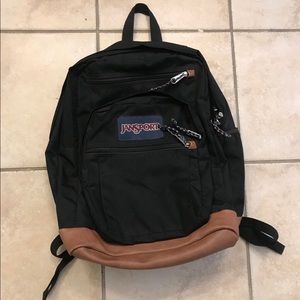 Black Jansport leather bottom backpack